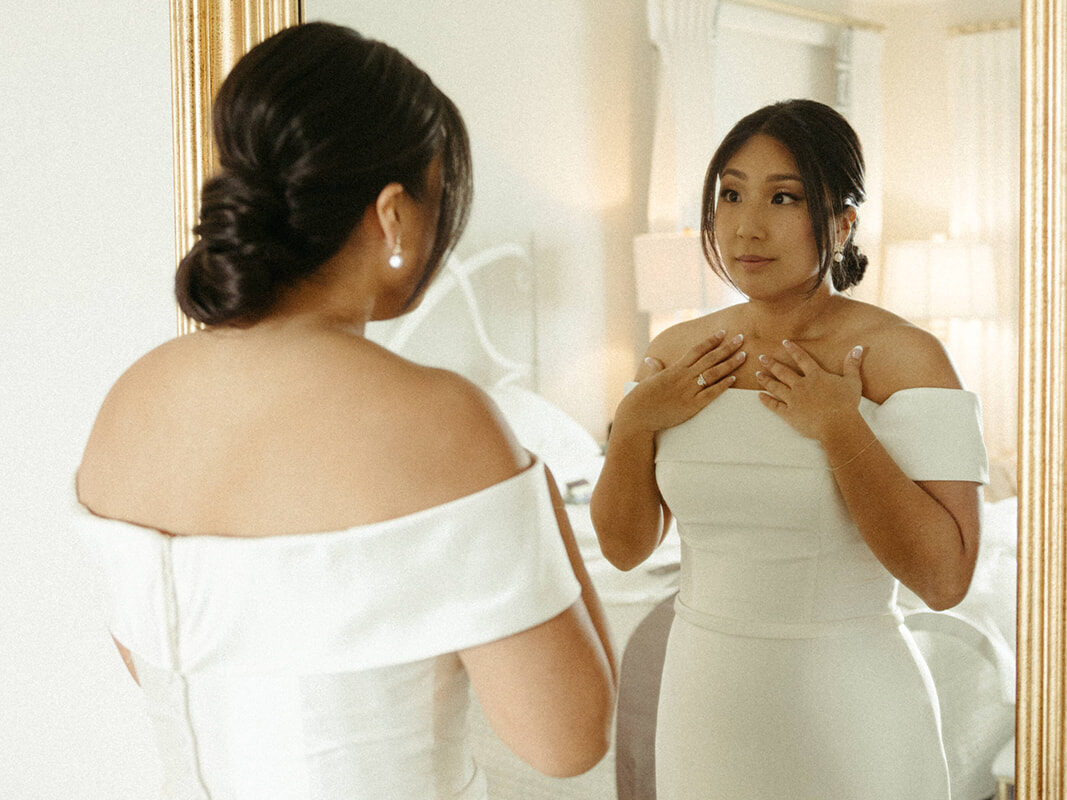 Bride takes one last look in the mirror before walking down the aisle.